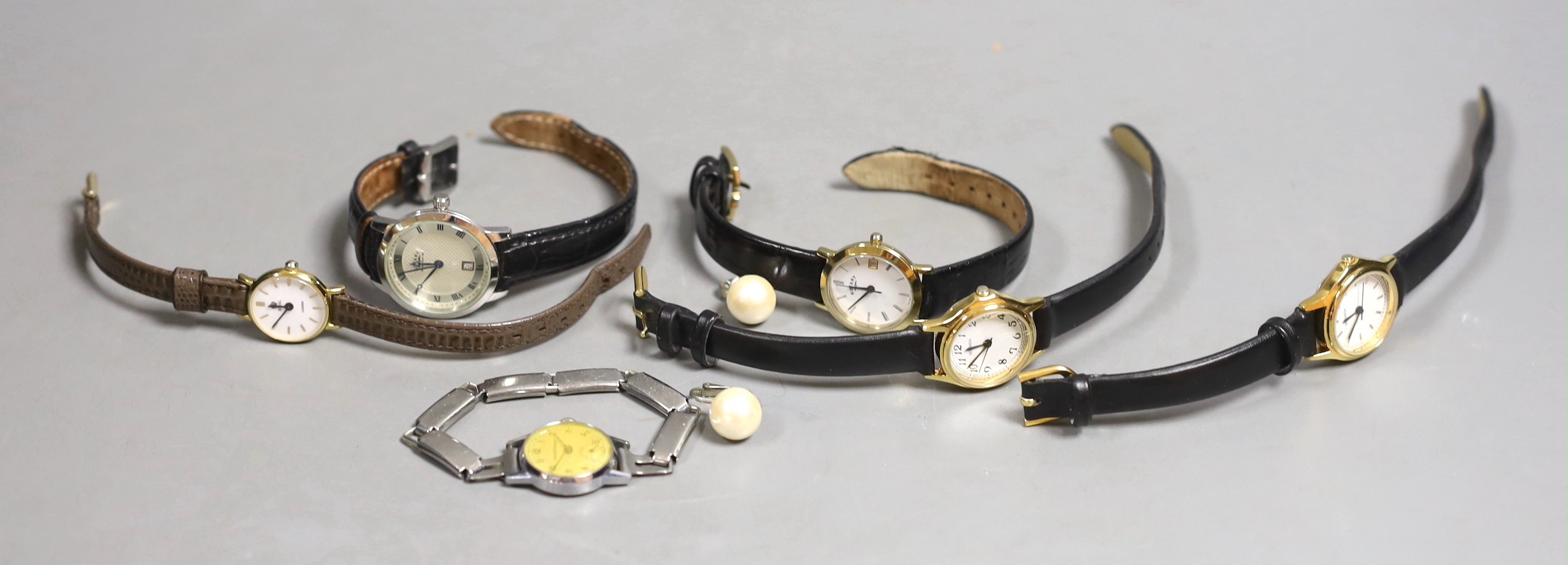 Six various lady's wrist watches, with quartz and other movements, including Sekonda and Rotary and a pair of simulated pearl earrings.